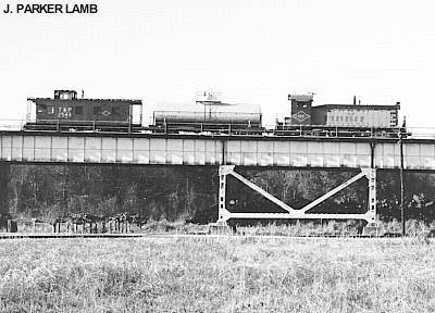 SW-8 812 & Caboose 2544<BR>Huey P. Long Bridge - New Orleans LA<BR>December 1957