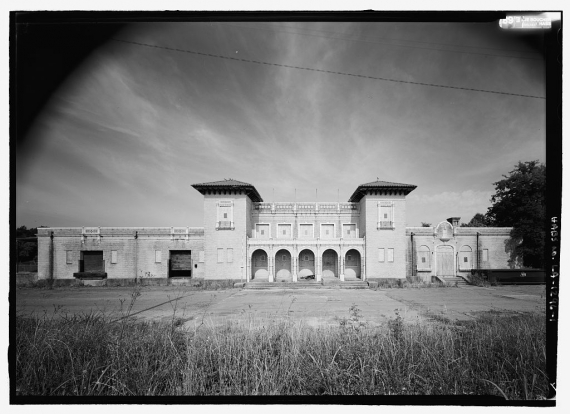 East (front) elevation, with scale