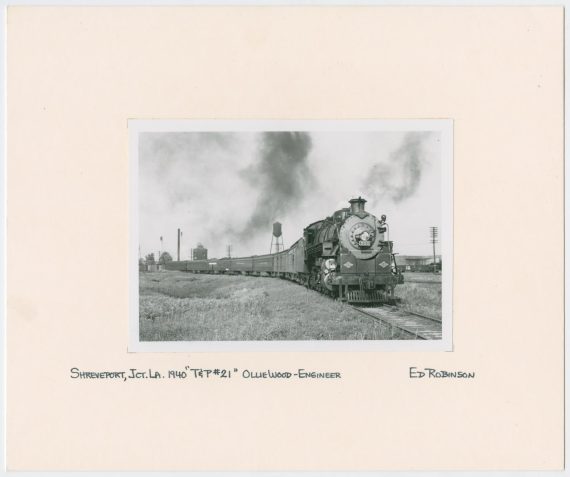Train Engine #700 and Cars on Tracks