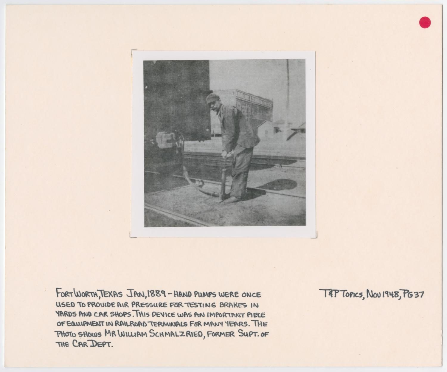 William Schmalzried Using a Hand Pump
