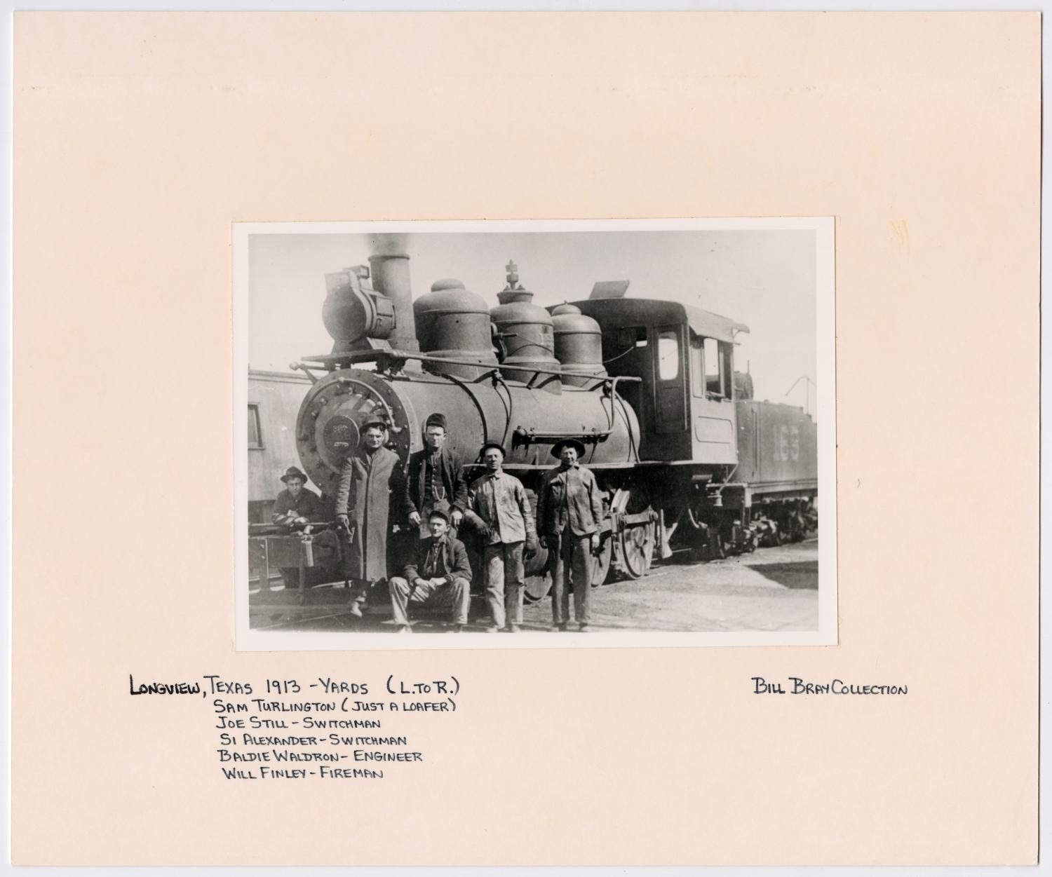 Six Men Posing in Front of a T&P Train