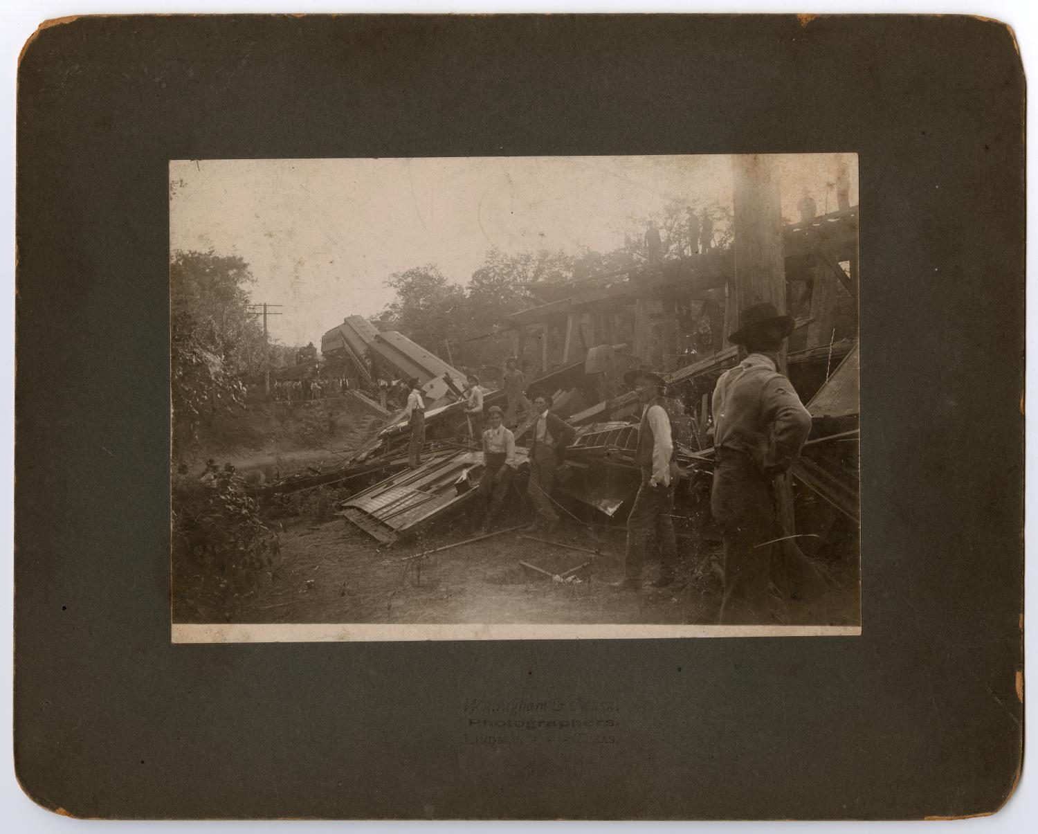 Men Inspecting Train Wreckage