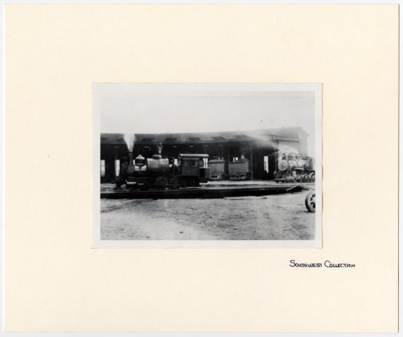 Train #40 in Front of a Roundhouse