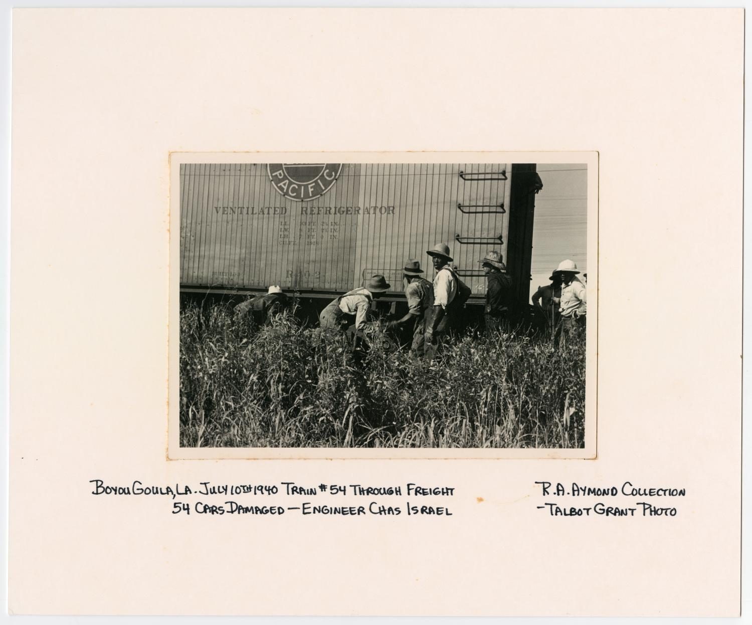 Men Inspecting a Train Wreck in Bayou Goula, Louisiana