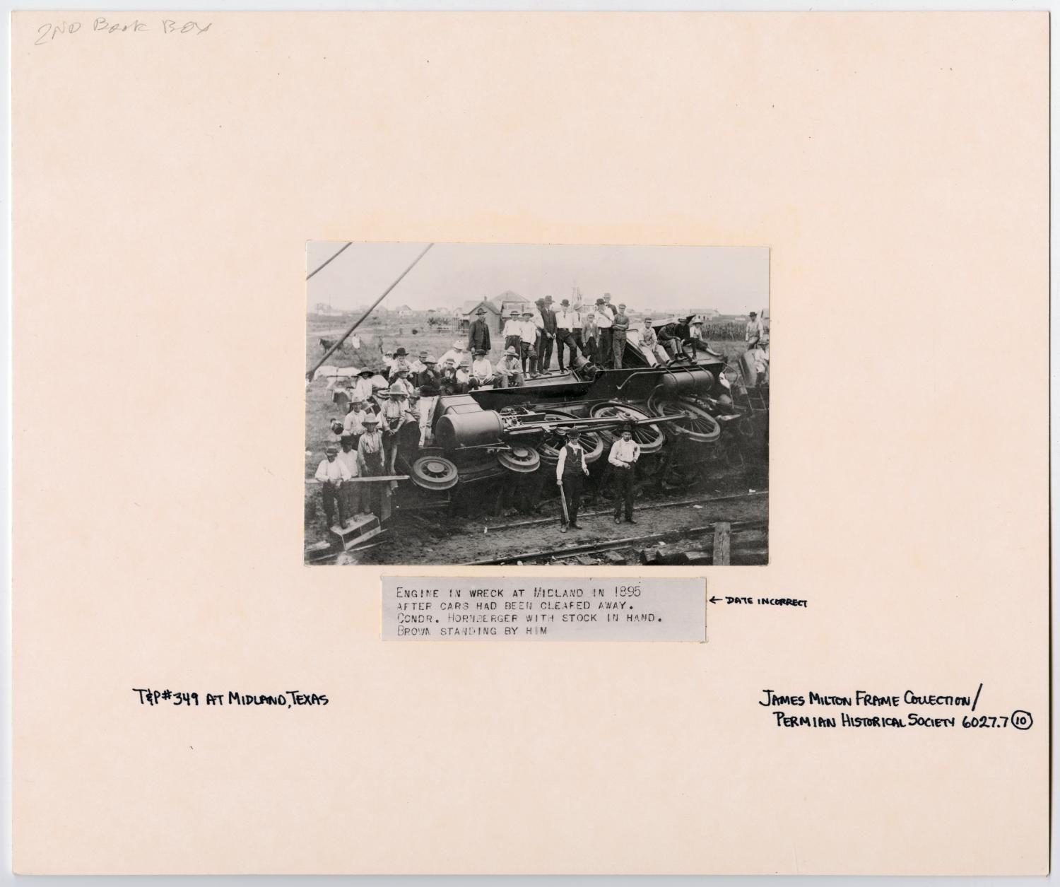 Group of Men with a Wrecked Train Engine