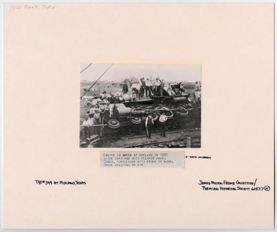 Group of Men with a Wrecked Train Engine