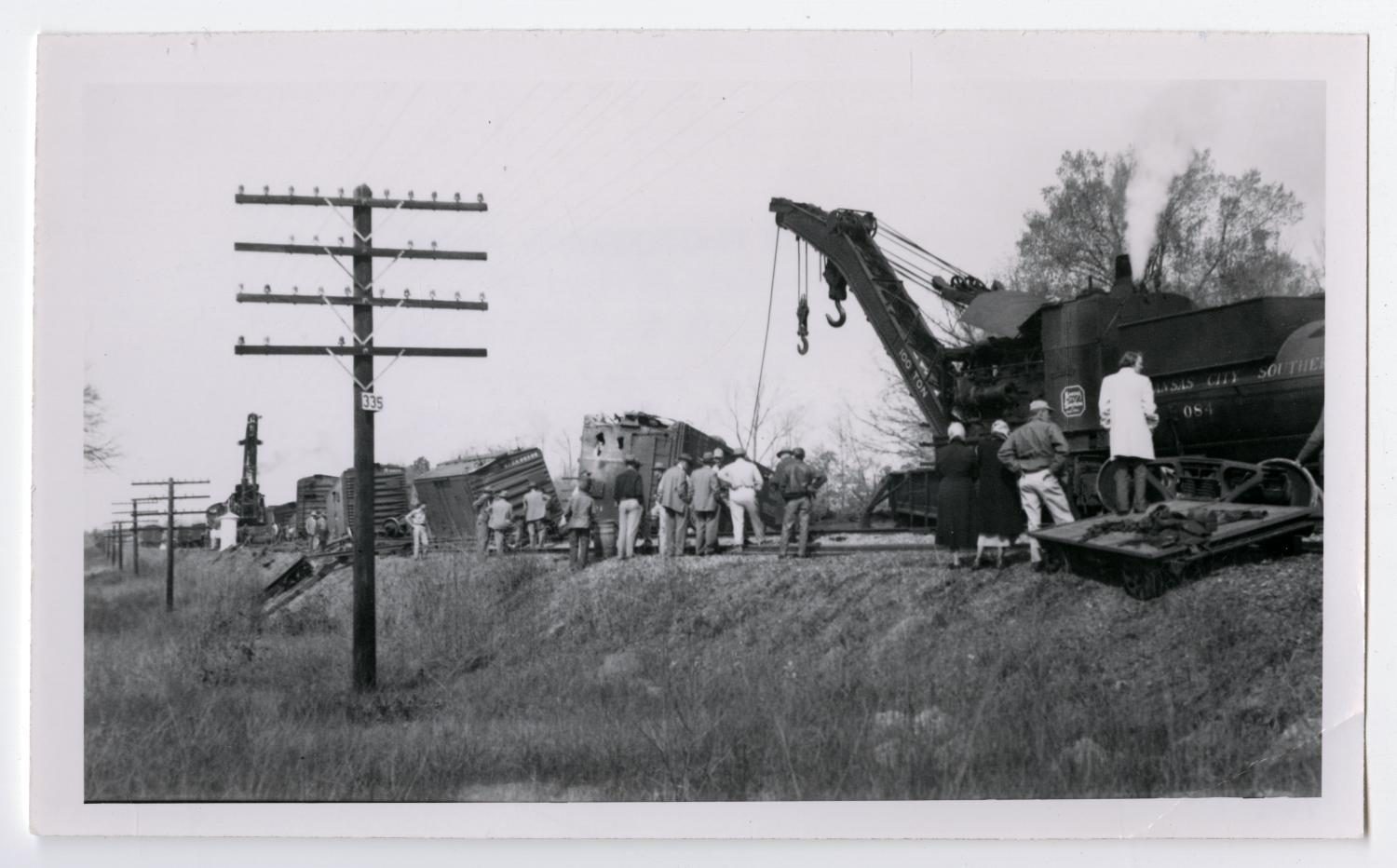 Men Inspecting a Wreck