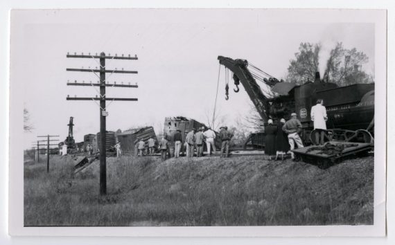 Men Inspecting a Wreck