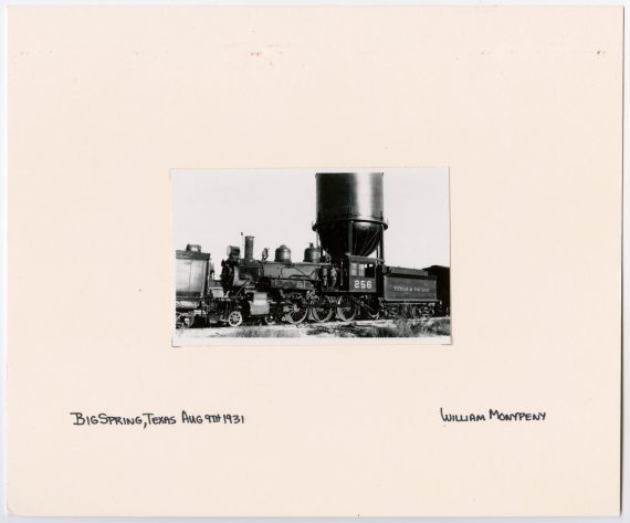 T&P Train #256 in Front of a Water Tower