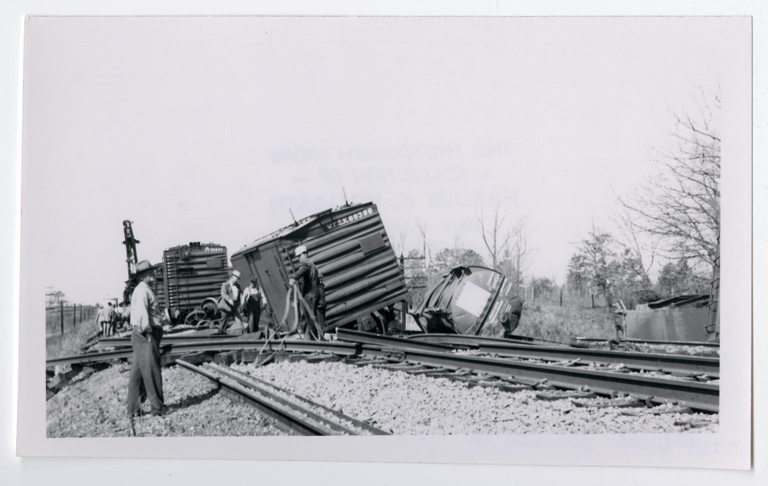 Men Inspecting a Wreck