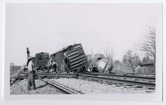 Men Inspecting a Wreck